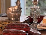 a table with a bunch of decorative items on top of it
