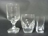 three glasses sitting next to each other on a table