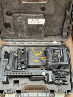 a tool in a case that is sitting on the floor