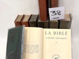 several books are stacked on top of each other on a table