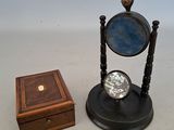 a small wooden box with a mirror on top of it