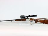 a rifle on a white background with a scope on it