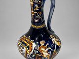 an image of a blue and gold vase with a dragon on it
