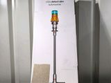the box of the dysonon vacuum is open on the table