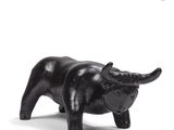 a black statue of a bull on a white background