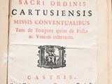 an old book that is open on a table