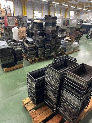 a large room with a lot of boxes and pallets on the floor