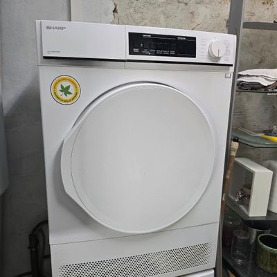 an image of a white washing machine in a room