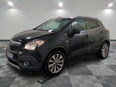 a picture of a black car parked in a garage