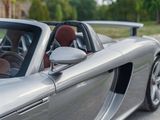 a silver sports car parked on the side of the road