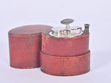 two red tins that are sitting next to each other