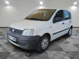 a picture of a small white van parked in a garage