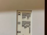 a close up of a white toilet with a button on it