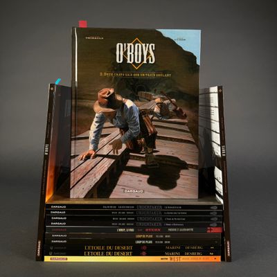 books stacked on top of each other on a gray surface