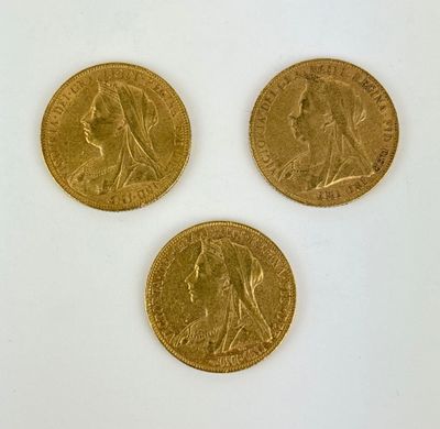 three gold sovereigns, one of which is a sovereign and one of which is a sovereign