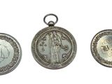 three silver lockes with a picture of a woman and a man