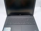 the dell laptop is open and ready to be used