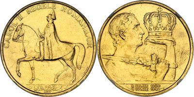a close up of two gold coins with a man on a horse