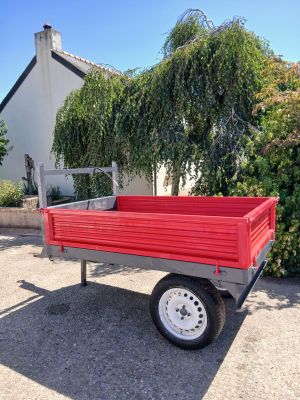 a red truck that is parked in front of a house