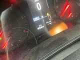 a car dashboard with a speedometer and a clock on it