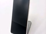 a phone that is sitting on top of a stand
