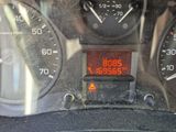 a close up of a car dashboard with a clock on it