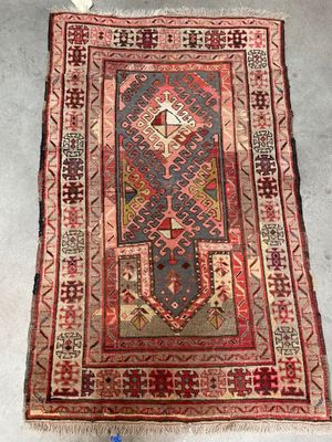 a rug with a red and blue design on it
