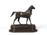 bronze statue of a horse on a wooden base on a white background