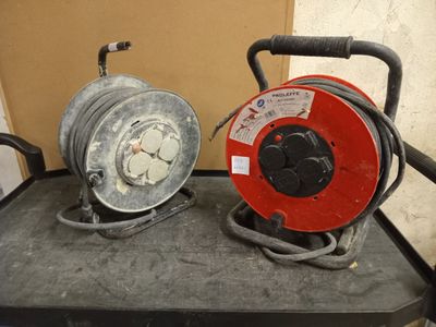 two hoses that are sitting on top of a cart