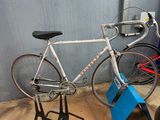 a bike that is sitting on a stand in a garage
