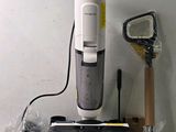 a vacuum that is sitting on a counter next to other items