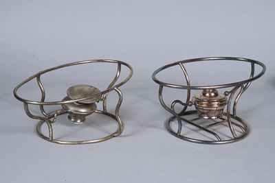 two small metal objects that are sitting on a table