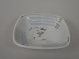 a white bowl with a measuring scale on it