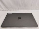 an apple macbook air laptop computer sitting on top of a white surface