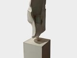 sculpture of a woman ' s foot on a pedestal with a white background