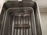 a deep fryer that is sitting on the counter