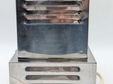 a small silver machine that is sitting on top of a table