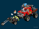 a toy truck with a man riding a motorcycle next to it