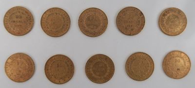 a close up of a bunch of coins on a white surface