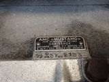 a sign on the side of the road that says amc mustang