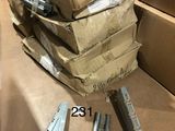 a stack of boxes and a pair of scissors on the floor