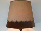 a lamp that is sitting on a table in a room