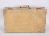 an old suitcase sitting on a white surface