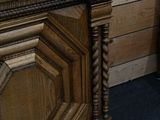 a wooden cabinet with a clock on top of it