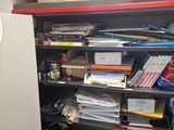 a cabinet full of files and papers in a room