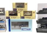 a lot of different model cars in a display case