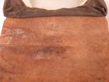 an image of a brown leather purse with a tan lining