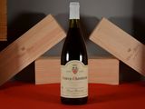 a bottle of wine that is sitting on a table
