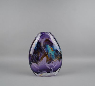 a purple and blue glass vase with a butterfly on it