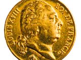 gros plan d'une pièce d'or sur fond blanc
